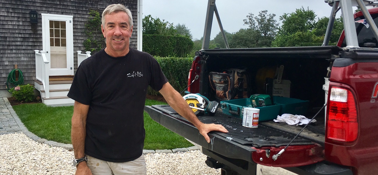 woodworker standing in front of his truck on Nantucket